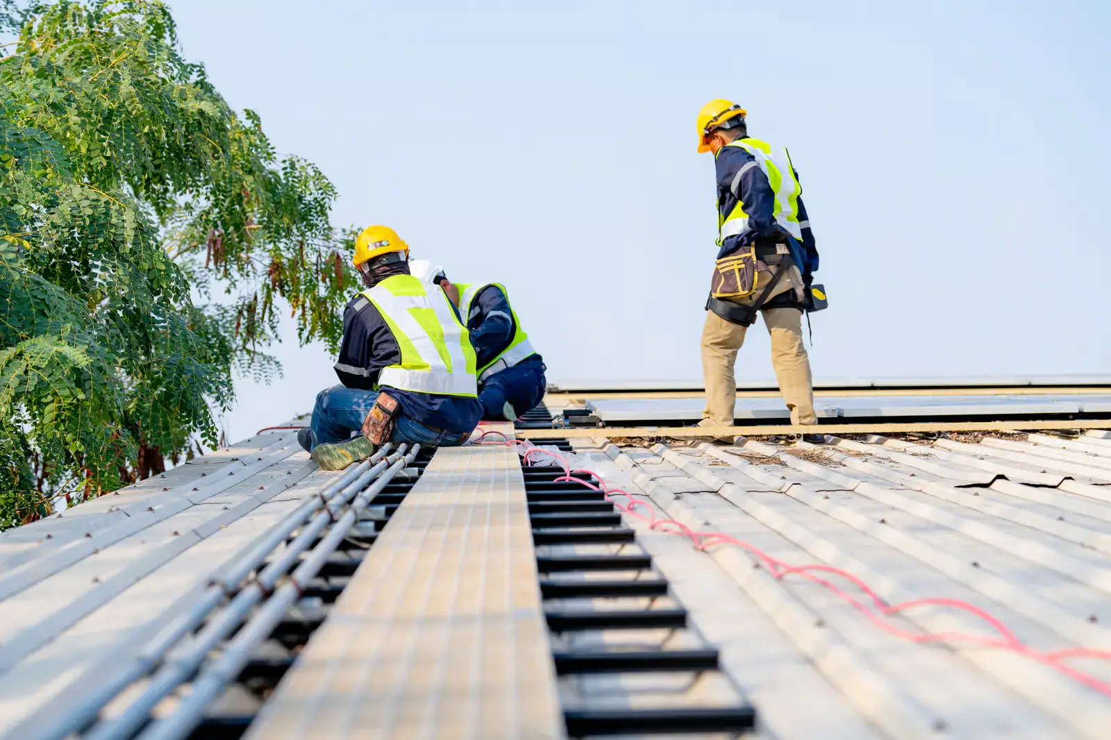 Roofing crew completing a full roof replacement project