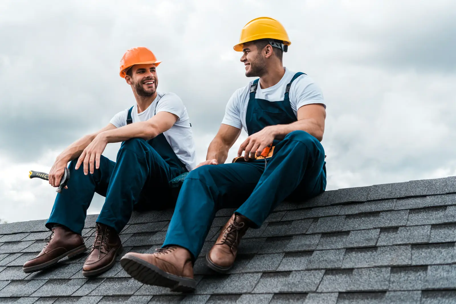 Roofing contractor on-site completing roof repair and replacement